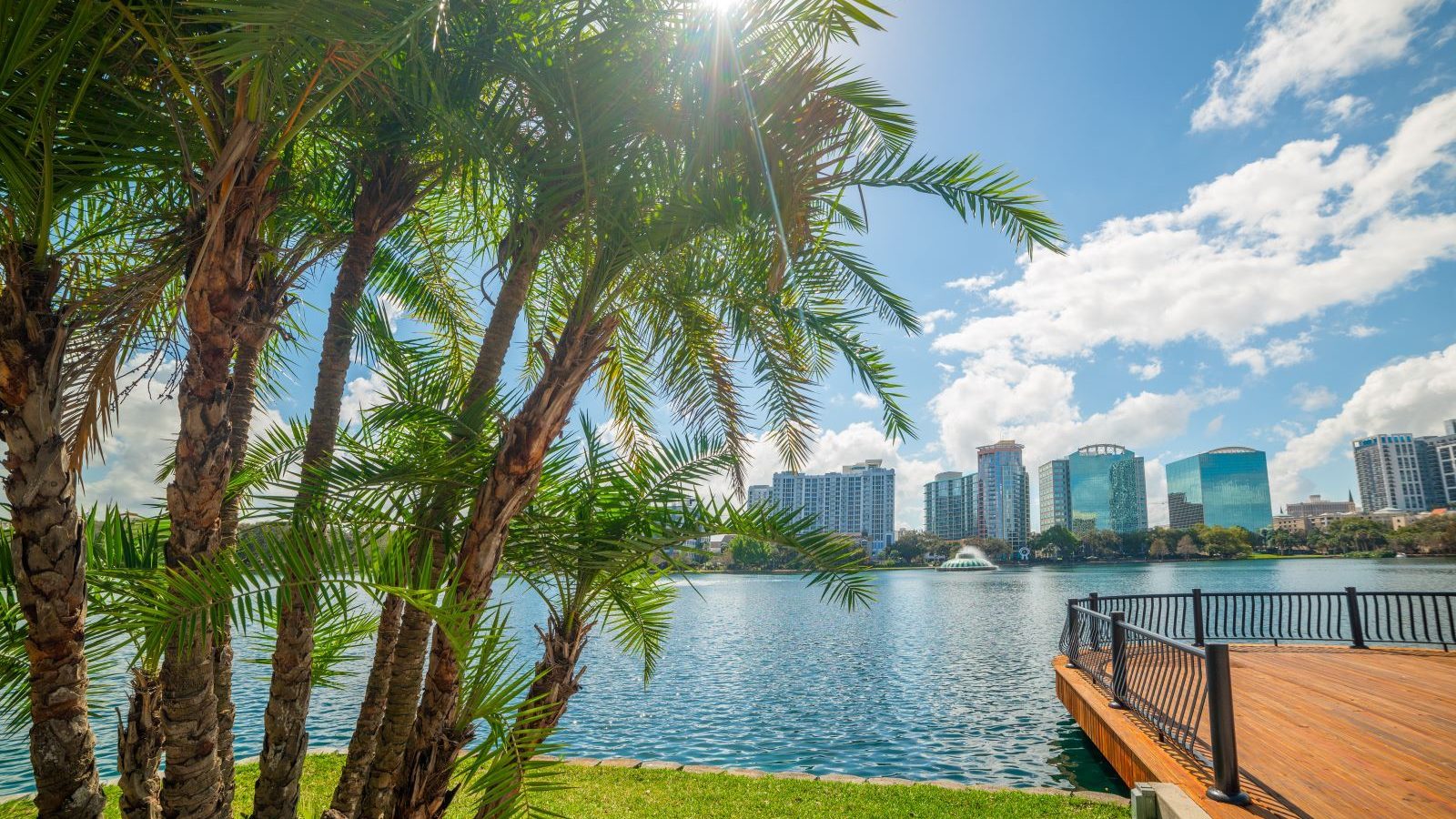 Sun shining over beautiful Lake Eola park in Orlando